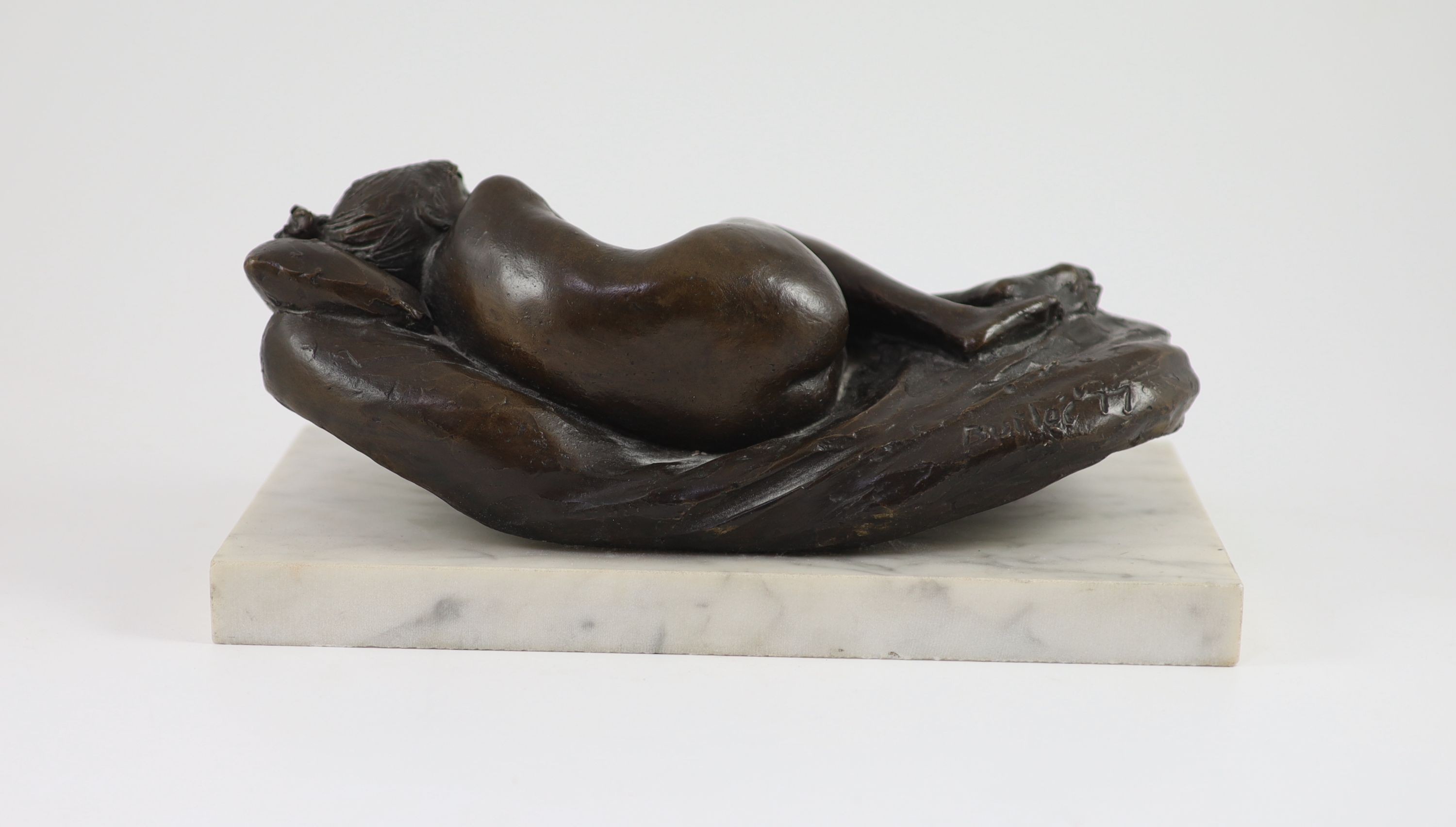 James W. Butler. RA., A bronze model of a sleeping girl, width 31cm depth 18cm height 13cm